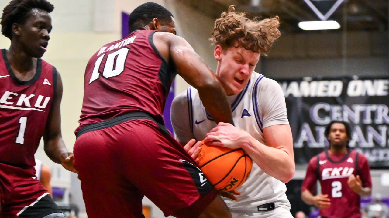 Bears forward Elias Cato battles for a loose ball against Eastern Kentucky