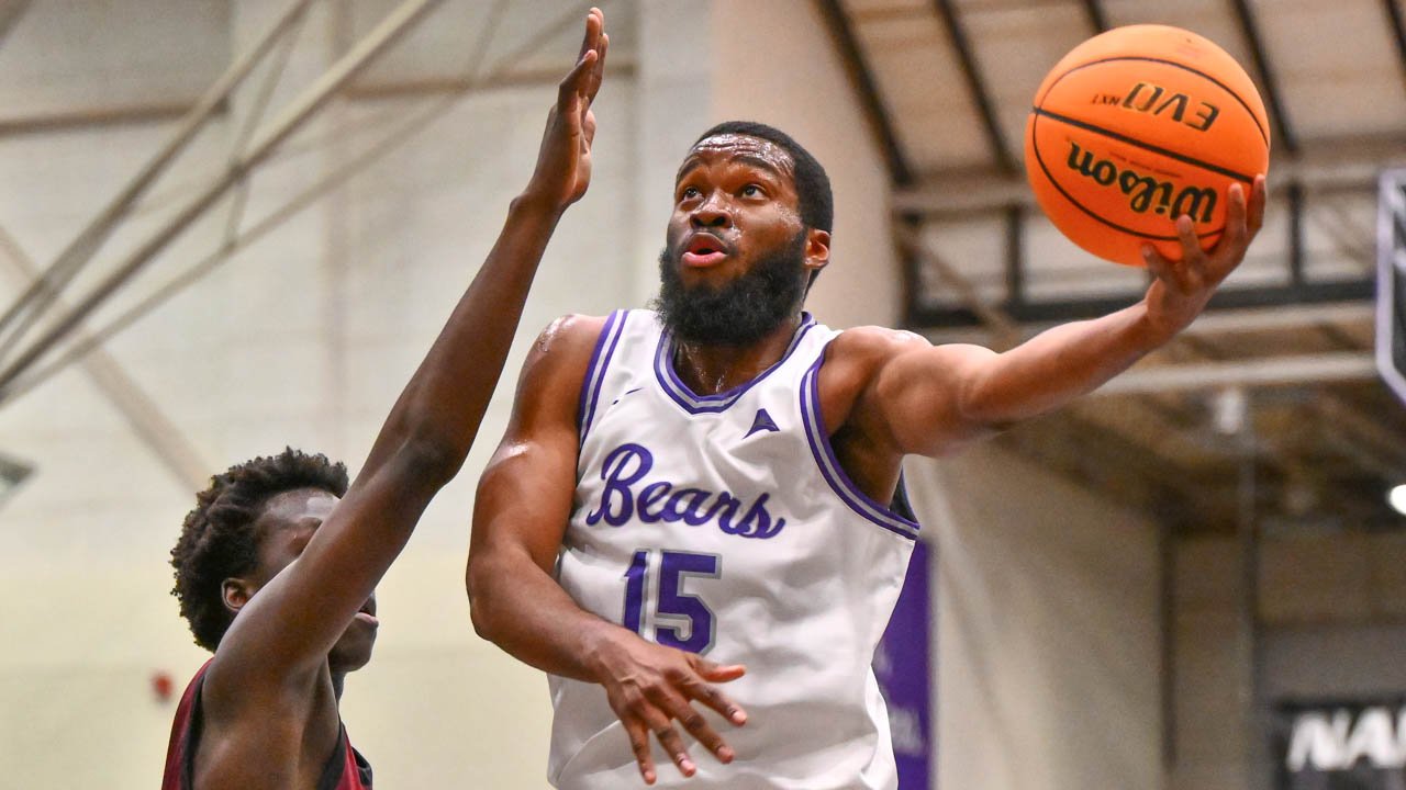 Bears forward Michael Evbagharu drives against Eastern Kentucky