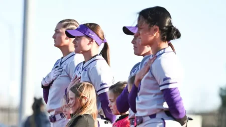 UCA Bears softball players lining up before game with the Memphis Tigers