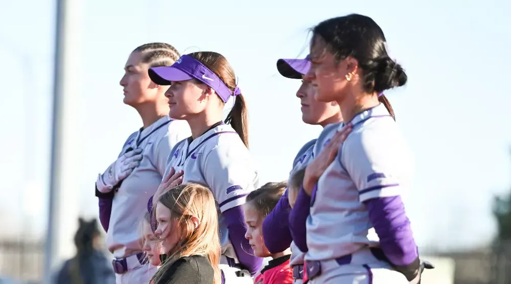 UCA Bears softball players lining up before game with the Memphis Tigers